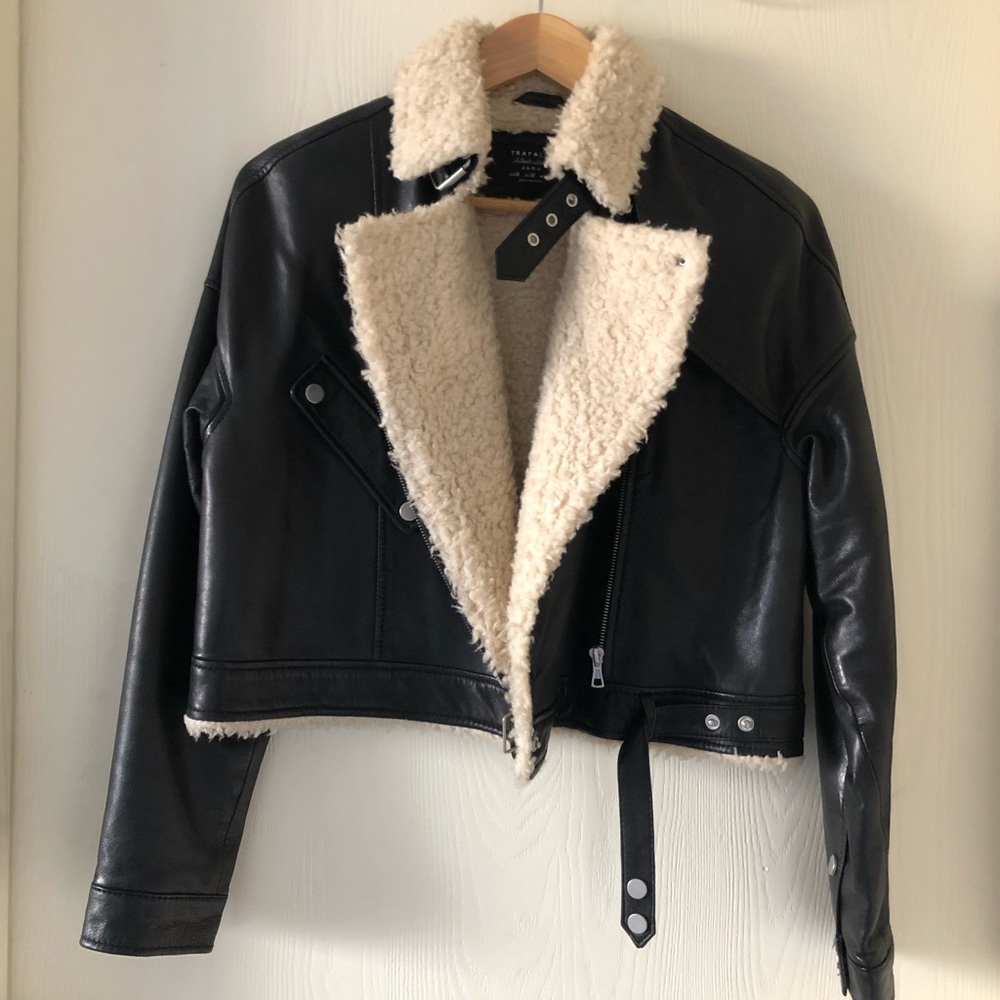 Gently worn; it’s in good condition. Genuine sheep leather